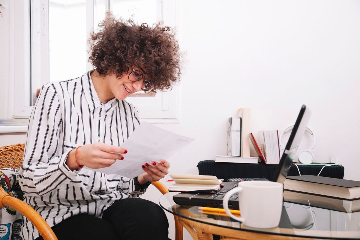 Teenager looking trough document